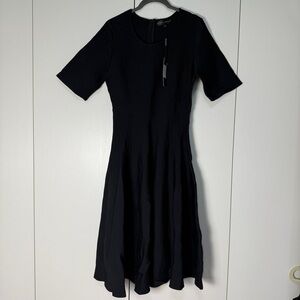 Elegant Black fit and flair Dress with floral accents size 38 (M)